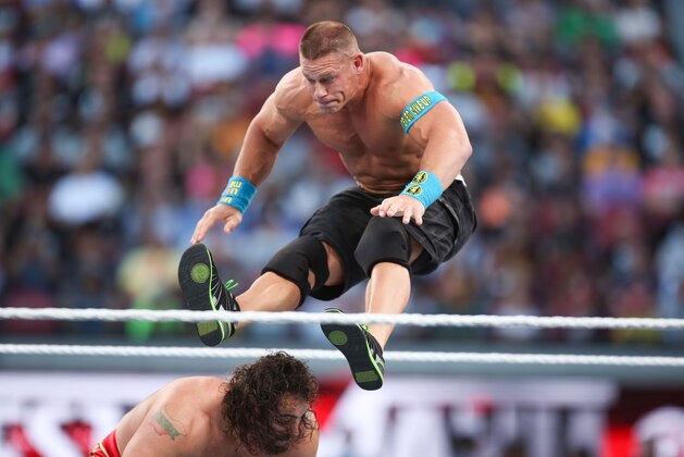 WWE wrestler John Cena lands on opponent Rusev at Wrestlemania XXXI, on Sunday, March 29, 2015 in Santa Clara, CA. 2015 marks the first year Wrestlemania will be held in the San Francisco Bay Area, being made available to viewers in 177 countries via the WWE Network. (Don Feria/AP Images for WWE) WWE wrestler John Cena lands on opponent Rusev at Wrestlemania XXXI, on Sunday, March 29, 2015 in Santa Clara, CA. 2015 marks the first year Wrestlemania will be held in the San Francisco Bay Area, being made available to viewers in 177 countries via the WWE Network. (Don Feria/AP Images for WWE)