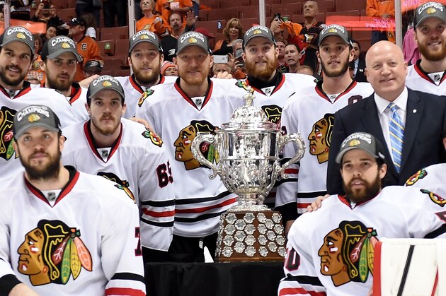 ANAHEIM, CA - MAY 30:  The Chicago Blackhawks pose in front of the Clarence S. Campbell Bowl with NHL Deputy Commissioner Bill Daly after the Blackhawks 5-3 victory against the Anaheim Ducks in Game Seven of the Western Conference Finals during the 2015 NHL Stanley Cup Playoffs  at the Honda Center on May 30, 2015 in Anaheim, California.  (Photo by Harry How/Getty Images)