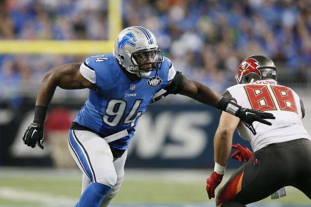 Detroit Lions defensive end Ezekiel Ansah (94) rushes the line past Tampa Bay Buccaneers tight end Luke Stocker (88) during the first half of an NFL football game in Detroit, Sunday, Dec. 7, 2014. (AP Photo/Paul Sancya)