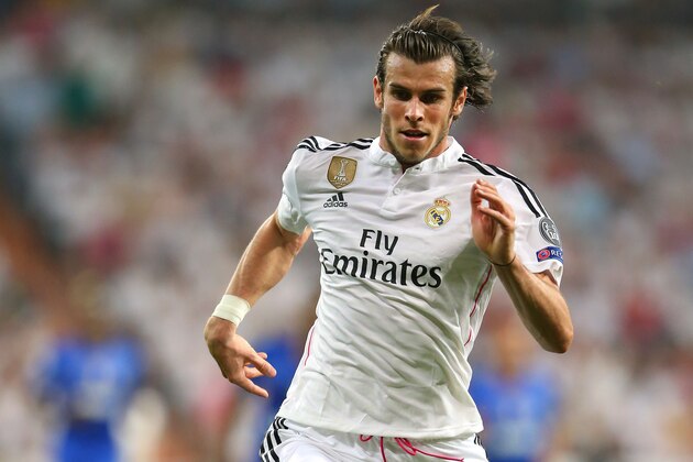 MADRID, SPAIN - MAY 13:  Gareth Bale of Real Madrid CF runs with the ball during the UEFA Champions League Semi Final second leg match between Real Madrid CF and Juventus at Estadio Santiago Bernabeu on May 13, 2015 in Madrid, Spain.  (Photo by Alex Livesey/Getty Images)