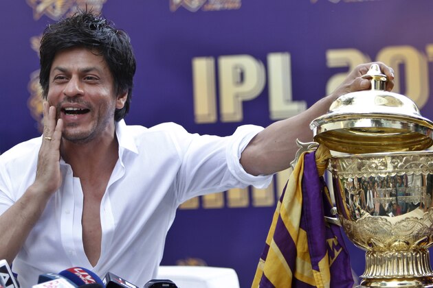 Kolkata Knight Riders team co-owner and Bollywood star Shah Rukh Khan poses with the Indian Premier League (IPL) trophy during a press conference at his residence in Mumbai, India, Wednesday, May 30, 2012. Kolkata Knight Riders won the IPL cricket title on Sunday, defeating two-time defending champion Chennai Super Kings by five wickets in a high-scoring final. (AP Photo/Rafiq Maqbool)