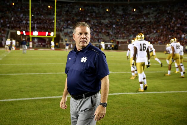 TALLAHASSEE, FL - OCTOBER 18:  Head coach Brian Kelly of the Notre Dame Fighting Irish walks on the field before their game against the Florida State Seminoles at Doak Campbell Stadium on October 18, 2014 in Tallahassee, Florida.  (Photo by Streeter Lecka/Getty Images)