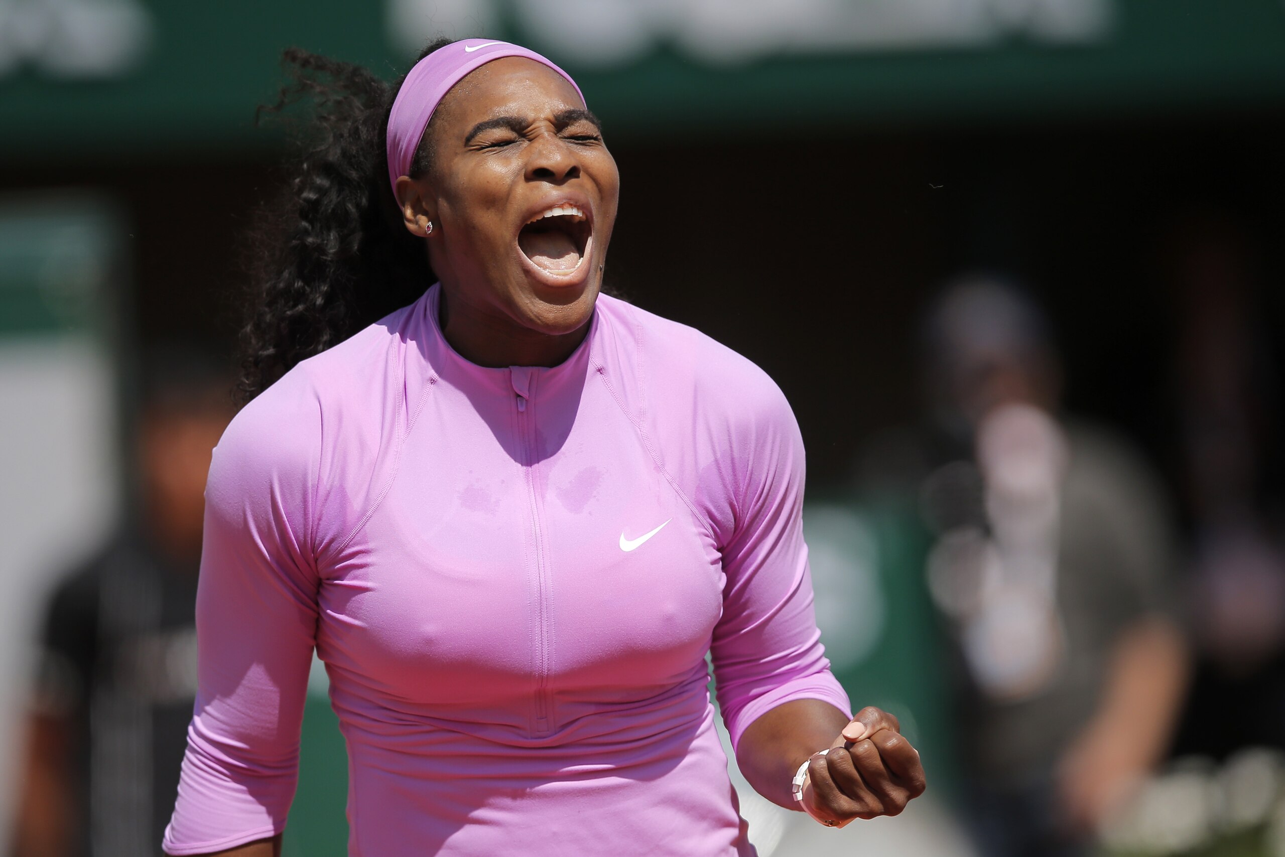 Serena Williams of the U.S. clenches her fist as she plays compatriot216 Sloane Stephens of the U.S. during their fourth round match of the French Open tennis tournament at the Roland Garros stadium, Monday, June 1, 2015 in Paris.  (AP Photo/Christophe Ena)