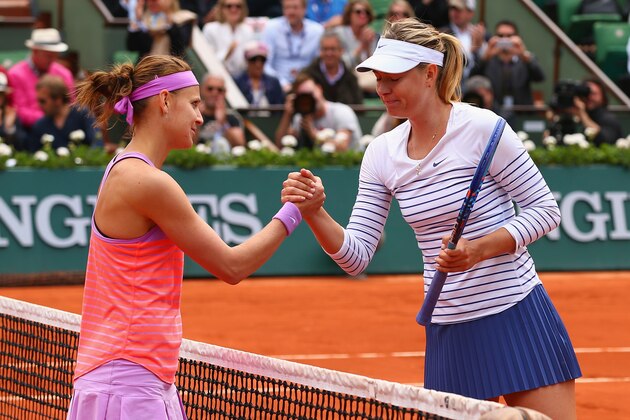 PARIS, FRANCE - JUNE 01:  Lucie Safarova of Czech Repbulic is congratulated on her victory by Maria Sharapova of Russia after their Women's Singles match on day nine of the 2015 French Open at Roland Garros on June 1, 2015 in Paris, France.  (Photo by Clive Brunskill/Getty Images)