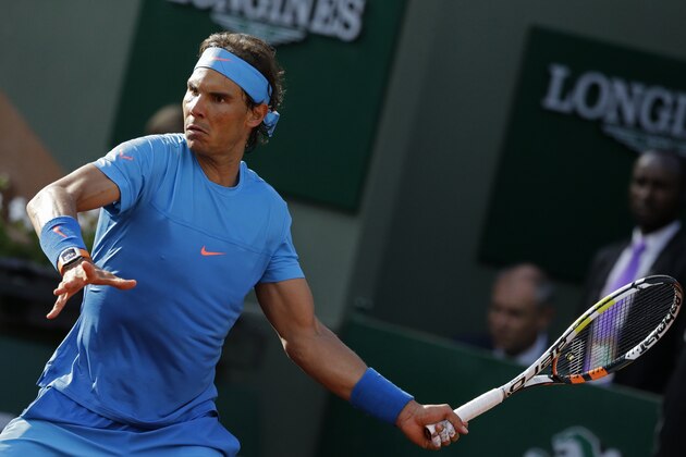 Spain's Rafael Nadal eyes the ball as he plays a shot in his fourth round match of the French Open tennis tournament against Jack Sock of the U.S. at the Roland Garros stadium, in Paris, France, Monday, June 1, 2015. Nadal won in four sets, 6-3, 6-1, 5-7, 6-2. (AP Photo/Thibault Camus)
