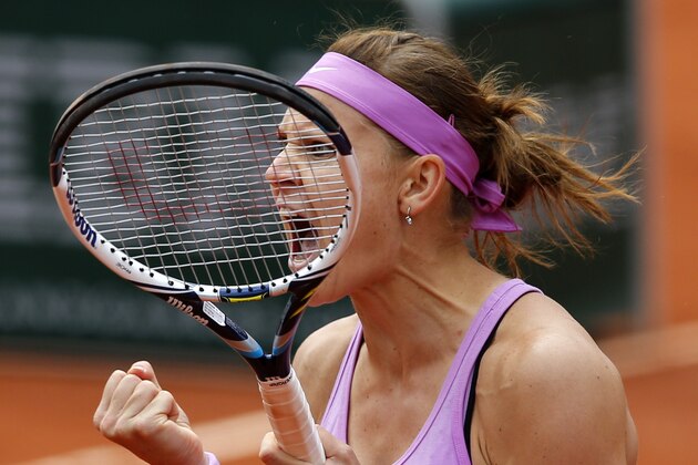 Lucie Safarova of the Czech Republic reacts as she defeats Russia's Maria Sharapova during their fourth round match of the French Open tennis tournament at the Roland Garros stadium, Monday, June 1, 2015 in Paris. Safarova won 7-6, 6-4. (AP Photo/Christophe Ena)