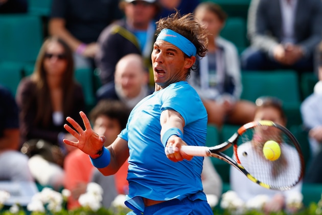 PARIS, FRANCE - JUNE 01:  Rafael Nadal of Spain returns a shot in his Men's Singles match against Jack Sock of the United States on day nine of the 2015 French Open at Roland Garros on June 1, 2015 in Paris, France.  (Photo by Julian Finney/Getty Images)