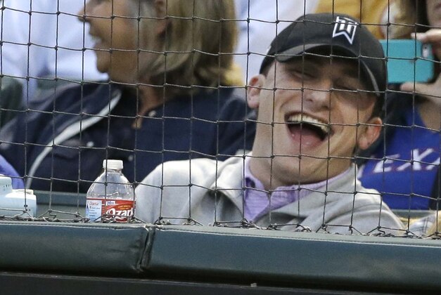 Cleveland Browns quarterback Johnny Manziel, left, laughs while sitting in the stands during a baseball game between the Los Angeles Angels and Texas Rangers in Arlington, Texas, Tuesday, April 14, 2015. (AP Photo/LM Otero) Cleveland Browns quarterback Johnny Manziel, left, laughs while sitting in the stands during a baseball game between the Los Angeles Angels and Texas Rangers in Arlington, Texas, Tuesday, April 14, 2015. (AP Photo/LM Otero)