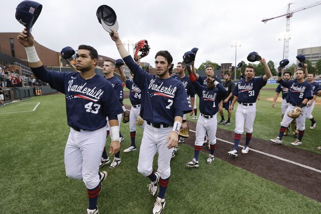 Vanderbilt players, including Zander Wiel (43) and Dansby Swanson (7) wave to the fans after beating Radford in an NCAA regional college baseball game Monday, June 1, 2015, in Nashville, Tenn. Vanderbilt won 21-0 to advance to the super regional round. (AP Photo/Mark Humphrey)