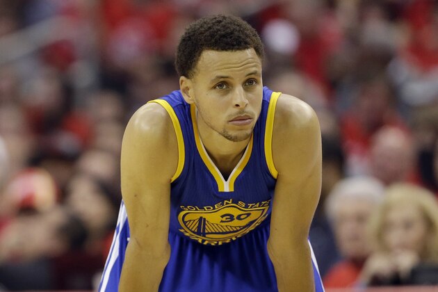 Golden State Warriors guard Stephen Curry (30) returns to the game, after being injured in a fall, during the second half in Game 4 of the NBA basketball Western Conference finals against the Houston Rockets, Monday, May 25, 2015, in Houston. (AP Photo/David J. Phillip)