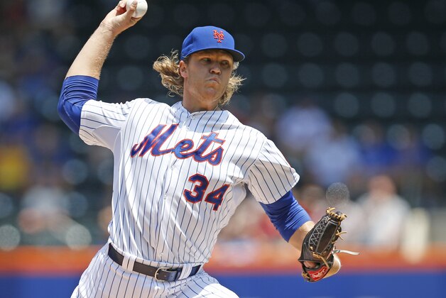 New York Mets starting pitcher Noah Syndergaard (34)] winds up in the first inning of his 7-0 shutout of the Philadelphia Phillies in a baseball game in New York, Wednesday, May 27, 2015. (AP Photo/Kathy Willens)