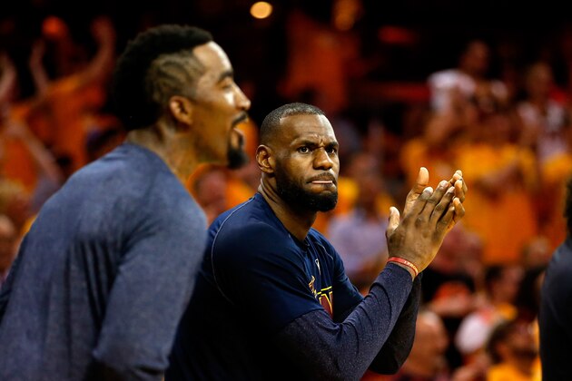CLEVELAND, OH - MAY 26: LeBron James #23 of the Cleveland Cavaliers reacts with J.R. Smith #5 late in the fourth quarter against the Atlanta Hawks during Game Four of the Eastern Conference Finals of the 2015 NBA Playoffs at Quicken Loans Arena on May 26, 2015 in Cleveland, Ohio. NOTE TO USER: User expressly acknowledges and agrees that, by downloading and or using this Photograph, user is consenting to the terms and conditions of the Getty Images License Agreement.  (Photo by Gregory Shamus/Getty Images)