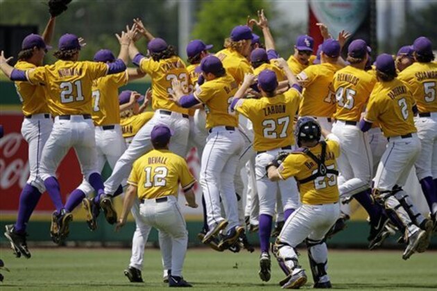 LSU players leap in the outfield after defeating UNC Wilmington at the Baton Rouge Regional of the NCAA college baseball tournament in Baton Rouge, La., Monday, June 1, 2015. LSU won 2-0 to win the tournament and advance to the super regionals. (AP Photo/Gerald Herbert)