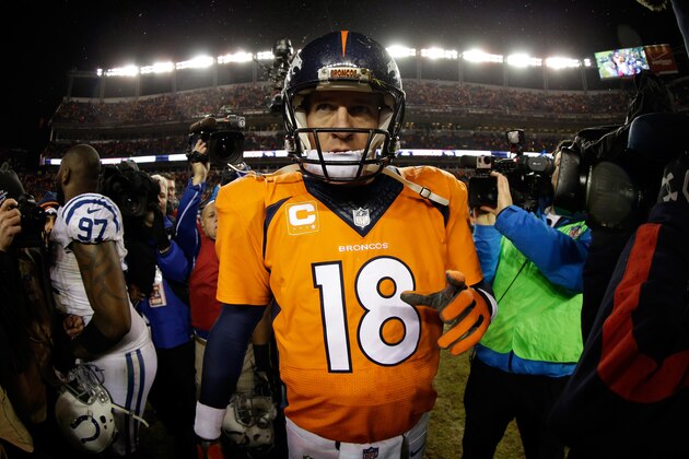 DENVER, CO - JANUARY 11: Peyton Manning #18 of the Denver Broncos walks off the field after losing 24-13 to the Indianapolis Colts in a 2015 AFC Divisional Playoff game at Sports Authority Field at Mile High on January 11, 2015 in Denver, Colorado.  (Photo by Ezra Shaw/Getty Images)
