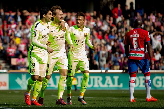 GRANADA, SPAIN - FEBRUARY 28:  Ivan Rakitic (2ndL) of FC Barcelona celebrates scoring their opening goal with team mates Luis Suarez (L) and Neymar JR. (R) during the La Liga match between Granada CF and FC Barcelona at Nuevo Estadio de los Carmenes on February 28, 2015 in Granada, Spain.  (Photo by Gonzalo Arroyo Moreno/Getty Images)