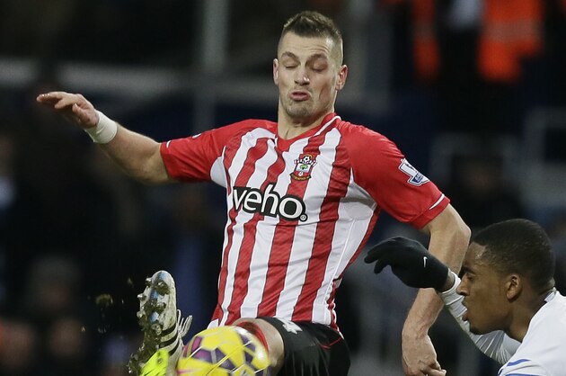 Queens Park Rangers’ Leroy Fer, right, competes for the ball with Southampton’s Morgan Schneiderlin during the English Premier League soccer match between Queens Park Rangers and Southampton at Loftus Road, London, England, Saturday, Feb. 7, 2015. (AP Photo/Tim Ireland)