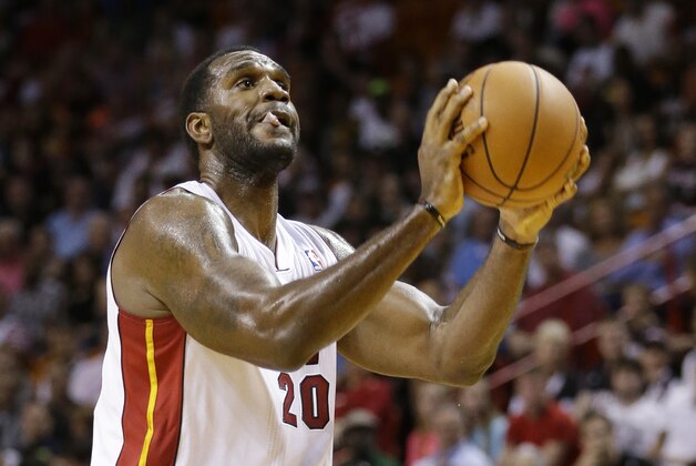 Miami Heat center Greg Oden shoots a free throw during the first half of an NBA basketball game against the Portland Trail Blazers, Monday, March 24, 2014 in Miami. (AP Photo/Wilfredo Lee)