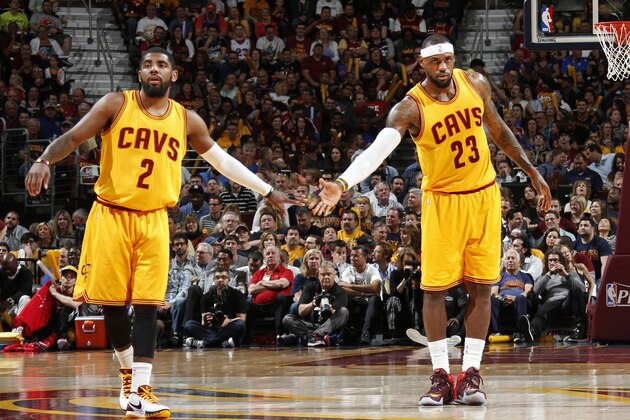 CLEVELAND, OHIO - MAY 6: Kyrie Irving #2 high fives LeBron James #23 of the Cleveland Cavaliers during Game Two of the Eastern Conference Semifinals during the NBA Playoffs on May 6, 2015 at Quicken Loans Arena in Cleveland, Ohio.  NOTE TO USER: User expressly acknowledges and agrees that, by downloading and or using this Photograph, user is consenting to the terms and conditions of the Getty Images License Agreement.  Mandatory Copyright Notice: Copyright 2015 NBAE (Photo by Greg Shamus/NBAE via Getty Images)