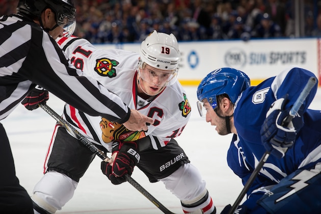 TAMPA, FL - OCTOBER 24: Tyler Johnson of the Tampa Bay Lightning faces off against Jonathan Toews #19 of the Chicago Blackhawks at the Tampa Bay Times Forum on October 24, 2013 in Tampa, Florida.  (Photo by Scott Audette/NHLI via Getty Images)