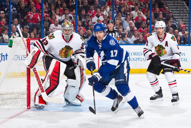 TAMPA, FL - FEBRUARY 27: Alex Killorn #17 of the Tampa Bay Lightning skates against goalie Scott Darling #33 of the Chicago Blackhawks at the Amalie Arena on February 27, 2015 in Tampa, Florida.  (Photo by Scott Audette/NHLI via Getty Images)