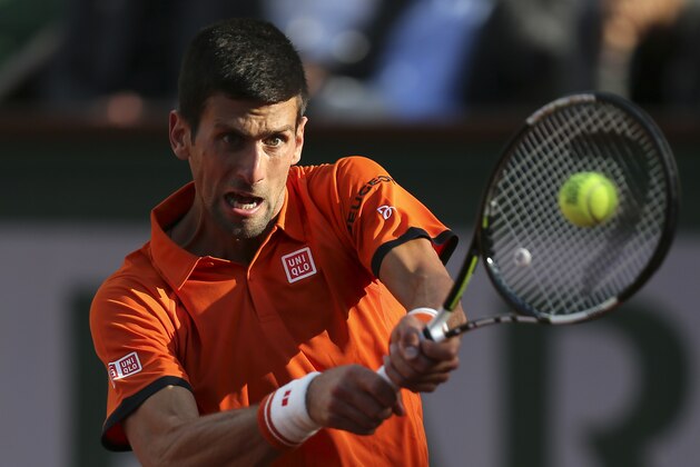 Serbia's Novak Djokovic returns the ball to France's Richard Gasquet during their fourth round match of the French Open tennis tournament at the Roland Garros stadium, Monday, June 1, 2015 in Paris.  (AP Photo/David Vincent)