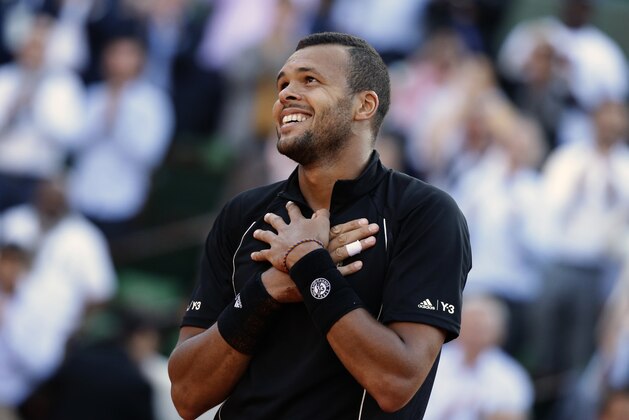 France's Jo-Wilfried Tsonga celebrates winning in the quarterfinal match of the French Open tennis tournament against Japan's Kei Nishikori in five sets 6-1, 6-4, 4-6, 3-6, 6-3, at the Roland Garros stadium, in Paris, France, Tuesday, June 2, 2015. (AP Photo/Thibault Camus)