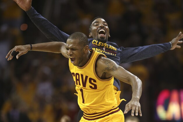 Cleveland Cavaliers forward James Jones (1) celebrates with guard J.R. Smith after the Cavaliers beat the Atlanta Hawks 118-88 in  Game 4 of the NBA basketball Eastern Conference Finals, Tuesday, May 26, 2015, in Cleveland. (AP Photo/Ron Schwane)