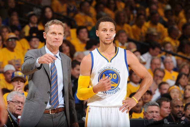 OAKLAND, CA - MAY 27: Steve Kerr and Stephen Curry #30 of the Golden State Warriors speak during a game against the Houston Rockets in Game Five of the Western Conference Finals of the 2015 NBA Playoffs on May 27, 2015 at Oracle Arena in Oakland, California. NOTE TO USER: User expressly acknowledges and agrees that, by downloading and or using this photograph, user is consenting to the terms and conditions of Getty Images License Agreement. Mandatory Copyright Notice: Copyright 2015 NBAE (Photo by Noah Graham/NBAE via Getty Images)