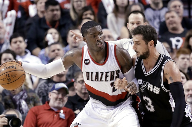 Portland Trail Blazers guard Wesley Matthews, left, works the ball in on San Antonio Spurs guard Marco Belinelli during the second half of an NBA basketball game in Portland, Ore., Wednesday, Feb. 25, 2015.  Matthews led the Trail Blazers in scoring with 31 points as Portland won 111-95. (AP Photo/Don Ryan)
