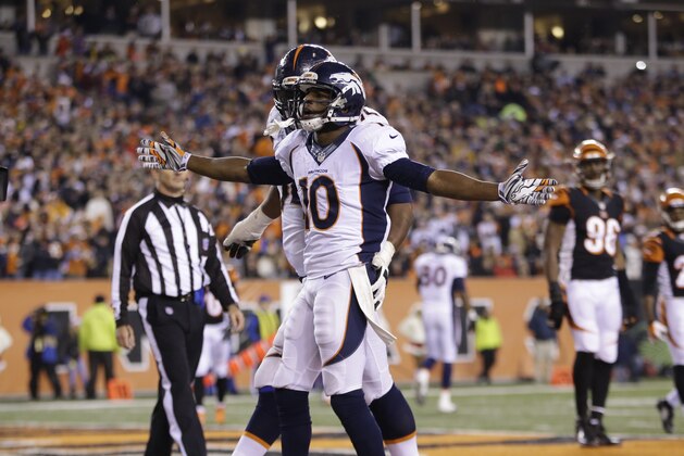 Denver Broncos wide receiver Emmanuel Sanders (10) reacts following a 4-yard touchdown reception during the second half of an NFL football game against the Cincinnati Bengals Monday, Dec. 22, 2014, in Cincinnati. (AP Photo/AJ Mast)