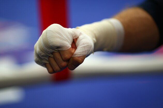 LONDON, ENGLAND - SEPTEMBER 16: George Groves gloves up during the George Groves media work out on September 16, 2014 in London, England. (Photo by Charlie Crowhurst/Getty Images) LONDON, ENGLAND - SEPTEMBER 16: George Groves gloves up during the George Groves media work out on September 16, 2014 in London, England. (Photo by Charlie Crowhurst/Getty Images)