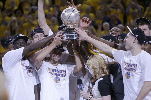Golden State Warriors players celebrate after Game 5 of the NBA basketball Western Conference finals against the Houston Rockets in Oakland, Calif., Wednesday, May 27, 2015. The Warriors won 104-90. (AP Photo/Ben Margot)