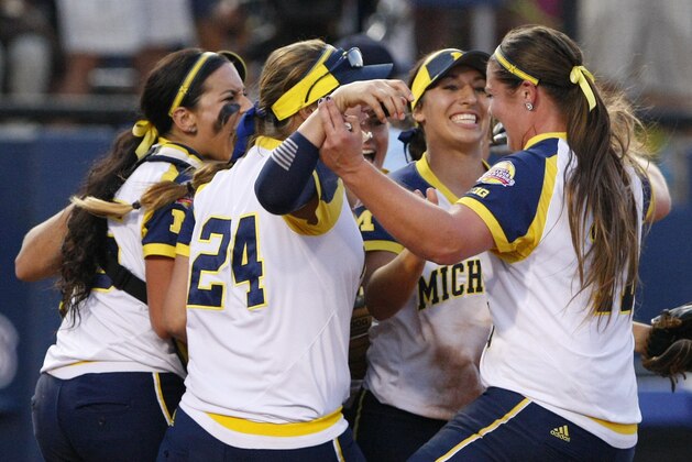 Michigan players celebrate after defeating Florida 1-0 during Game 2 of the finals in the NCAA softball Women's College World Series, Tuesday, June 2, 2015, in Oklahoma City. The series goes to a deciding third game. (AP Photo/Alonzo Adams)