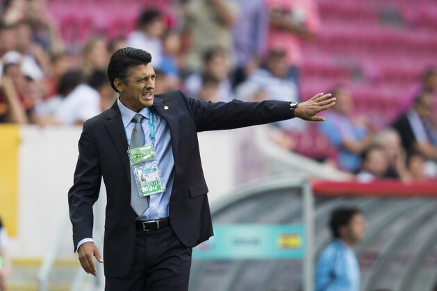 Mexico's head coach Sergio Almaguer gestures during the Under-20 World Cup round of sixteen soccer match between Spain and Mexico in Istanbul, Turkey, Tuesday, July 2, 2013. (AP Photo/Gero Breloer)
