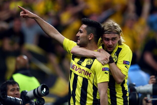 LONDON, ENGLAND - MAY 25:  Ilkay Gundogan of Borussia Dortmund (L) celebrates with team-mate Marcel Schmelzer after scoring a goal from the penalty spot during the UEFA Champions League final match between Borussia Dortmund and FC Bayern Muenchen at Wembley Stadium on May 25, 2013 in London, United Kingdom.  (Photo by Alex Grimm/Getty Images)