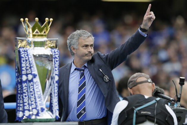 FILE - In this May 24, 2015 file photo Chelsea Manager Jose Mourinho waves to the crowd after the English Premier League soccer match between Chelsea and Sunderland at Stamford Bridge stadium in London. Chelsea were awarded the trophy after winning the English Premier League. (AP Photo/Tim Ireland, file)