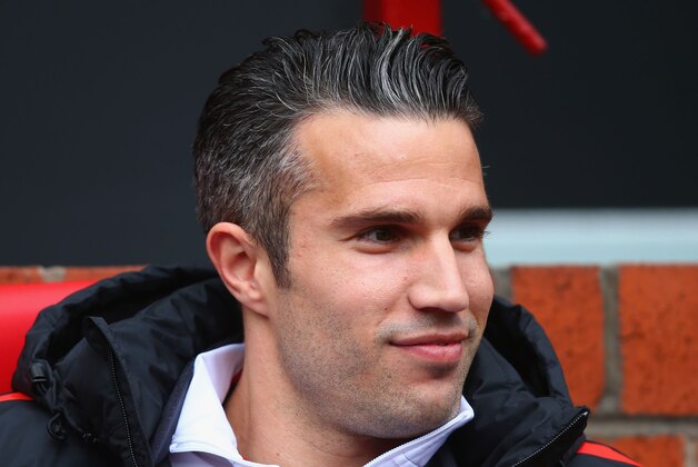MANCHESTER, ENGLAND - MAY 17:  Robin van Persie of Manchester United looks on from the bench prior to the Barclays Premier League match between Manchester United and Arsenal at Old Trafford on May 17, 2015 in Manchester, England.  (Photo by Clive Rose/Getty Images)