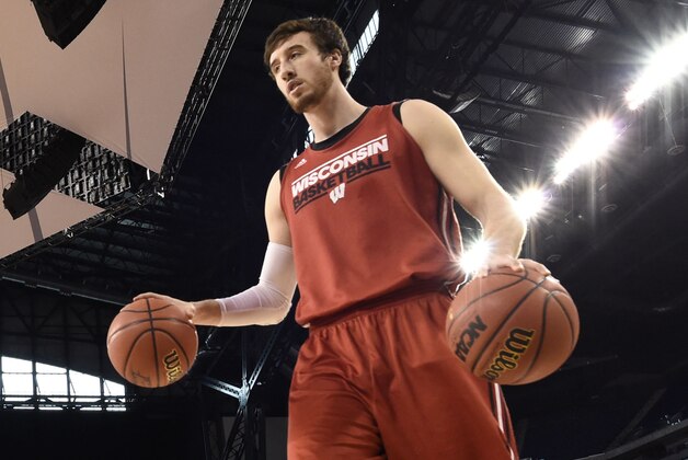 Apr 3, 2015; Indianapolis, IN, USA; Wisconsin Badgers forward Frank Kaminsky dribbles two basketballs during practice for the 2015 NCAA Men's Division I Championship semi-final game at Lucas Oil Stadium. Mandatory Credit: Bob Donnan-USA TODAY Sports