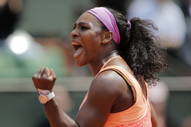 Serena Williams of the U.S. clenches her fist after scoring a point in the quarterfinal match of the French Open tennis tournament against Italy's Sara Errani at the Roland Garros stadium, in Paris, France, Wednesday, June 3, 2015. (AP Photo/Christophe Ena)