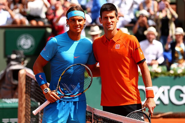 PARIS, FRANCE - JUNE 03:  Rafael Nadal of Spain and Novak Djokovic of Serbia pose at the net before their men's singles quarter final match on day eleven of the 2015 French Open at Roland Garros on June 3, 2015 in Paris, France.  (Photo by Clive Brunskill/Getty Images)