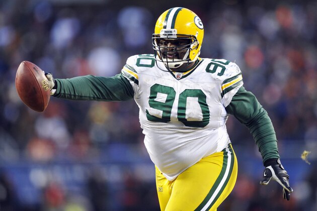 Green Bay Packers defensive tackle B.J. Raji (90) reacts after intercepting and running the ball back for a touchdown against the Chicago Bears during the second half of the NFC Championship NFL football game Sunday, Jan. 23, 2011, in Chicago. (AP Photo/Jim Prisching)