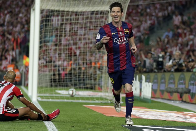Barcelona's Lionel Messi celebrates after scoring his side’s third goal during the final of the Copa del Rey soccer match between FC Barcelona and Athletic Bilbao at the Camp Nou stadium in Barcelona, Spain, Saturday, May 30, 2015. (AP Photo/Manu Fernandez)
