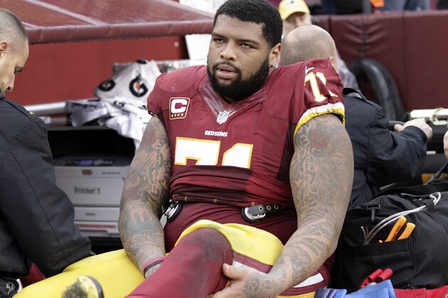 Washington Redskins tackle Trent Williams (71) is taken off the field after an injury during the second half of an NFL football game against the Dallas Cowboys in Landover, Md., Sunday, Dec. 28, 2014. (AP Photo/Mark Tenally)