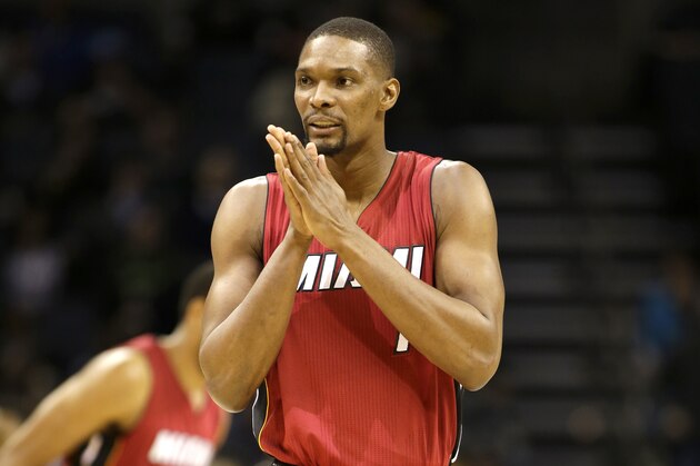 Miami Heat's Chris Bosh (1) against the Charlotte Hornets during the first half of an NBA basketball game in Charlotte, N.C., Wednesday, Jan. 21, 2015. The Hornets won 78-76. (AP Photo/Bob Leverone)