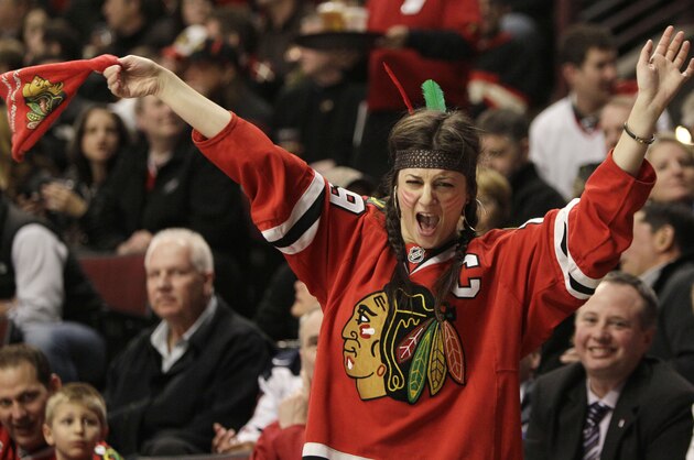 A Chicago Blackhawks fan cheers during the second period in Game 4 of an NHL hockey Stanley Cup playoffs first-round series against the Vancouver Canucks on Tuesday, April 19, 2011, in Chicago. (AP Photo/Nam Y. Huh)
