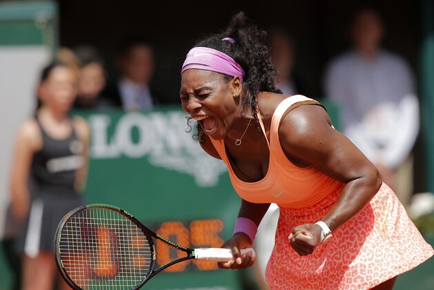 Serena Williams of the U.S. screams as she defeats Italy's Sara Errani in the quarterfinal match of the French Open tennis tournament in two sets 6-1, 6-3, at the Roland Garros stadium, in Paris, France, Wednesday, June 3, 2015. (AP Photo/Christophe Ena)