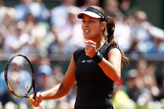 PARIS, FRANCE - JUNE 02:  Ana Ivanovic of Serbia celebrates a point in her Women's quarter final match against Elina Svitolina of Ukraine on day of the 2015 French Open at Roland Garros on June 2, 2015 in Paris, France.  (Photo by Julian Finney/Getty Images)