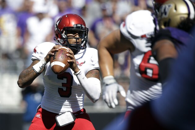 Eastern Washington quarterback Vernon Adams Jr. throws against Washington Huskies in the second half of an NCAA football game Saturday, Sept. 6, 2014, in Seattle. Washington won 59-52. (AP Photo/Elaine Thompson)