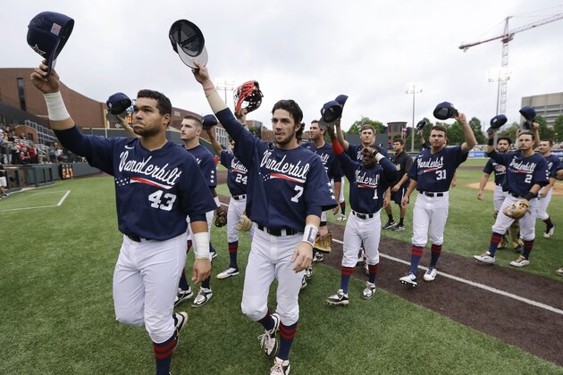 Vanderbilt players, including Zander Wiel (43) and Dansby Swanson (7) wave to the fans after beating Radford in an NCAA regional college baseball game Monday, June 1, 2015, in Nashville, Tenn. Vanderbilt won 21-0 to advance to the super regional round. (AP Photo/Mark Humphrey)
