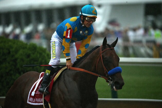 BALTIMORE, MD - MAY 16:  American Pharoah #1 ridden by Victor Espinoza crosses the finish line to win the 140th running of the Preakness Stakes at Pimlico Race Course on May 16, 2015 in Baltimore, Maryland.  (Photo by Patrick Smith/Getty Images)